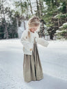 Girl wearing linen dress wearing in winter